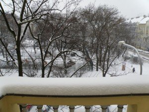 Snow on street light in Prague