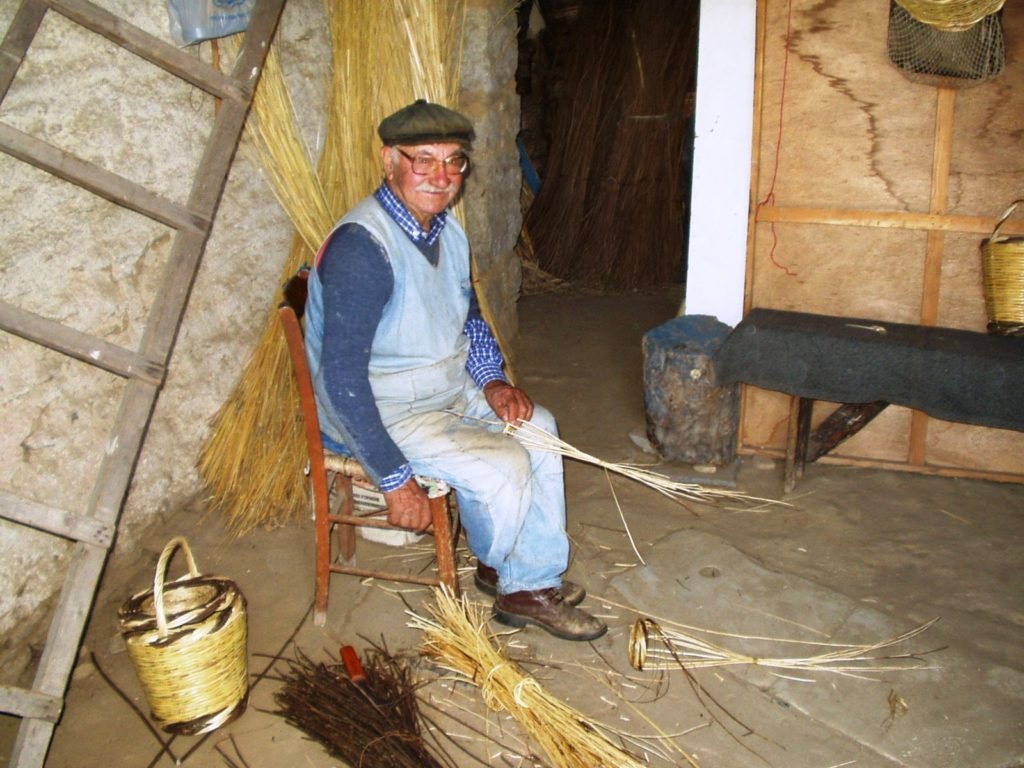 old man weaving basket