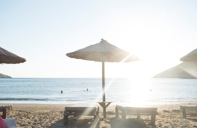 bright sun on sunbeds at the beach